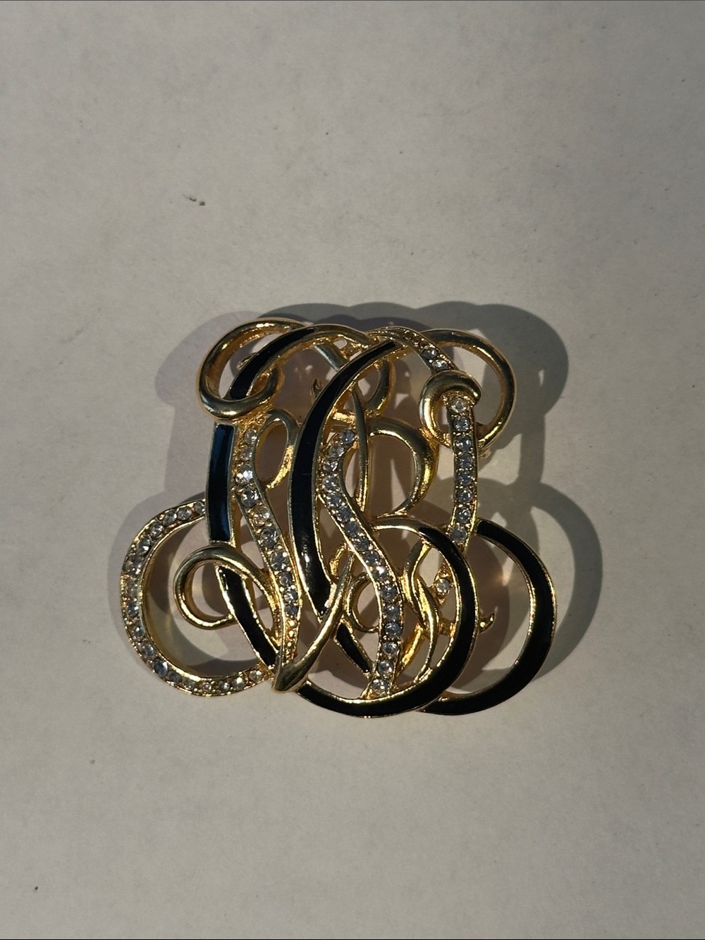 Gold Tone Black Enamel & Crystal Swirl Brooch - Designer Style